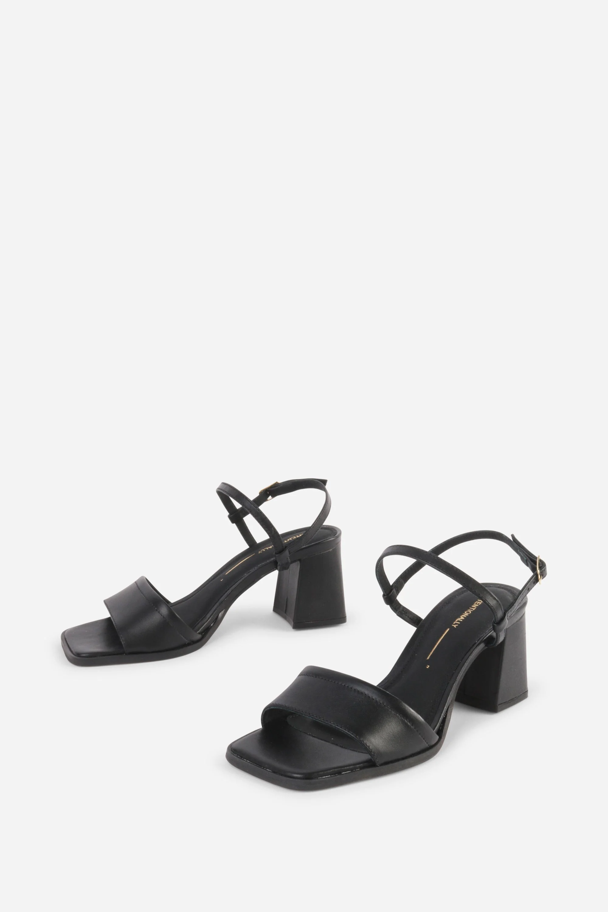 "INTENTIONALLY __________." VALIDATED LEATHER HEEL - Black
