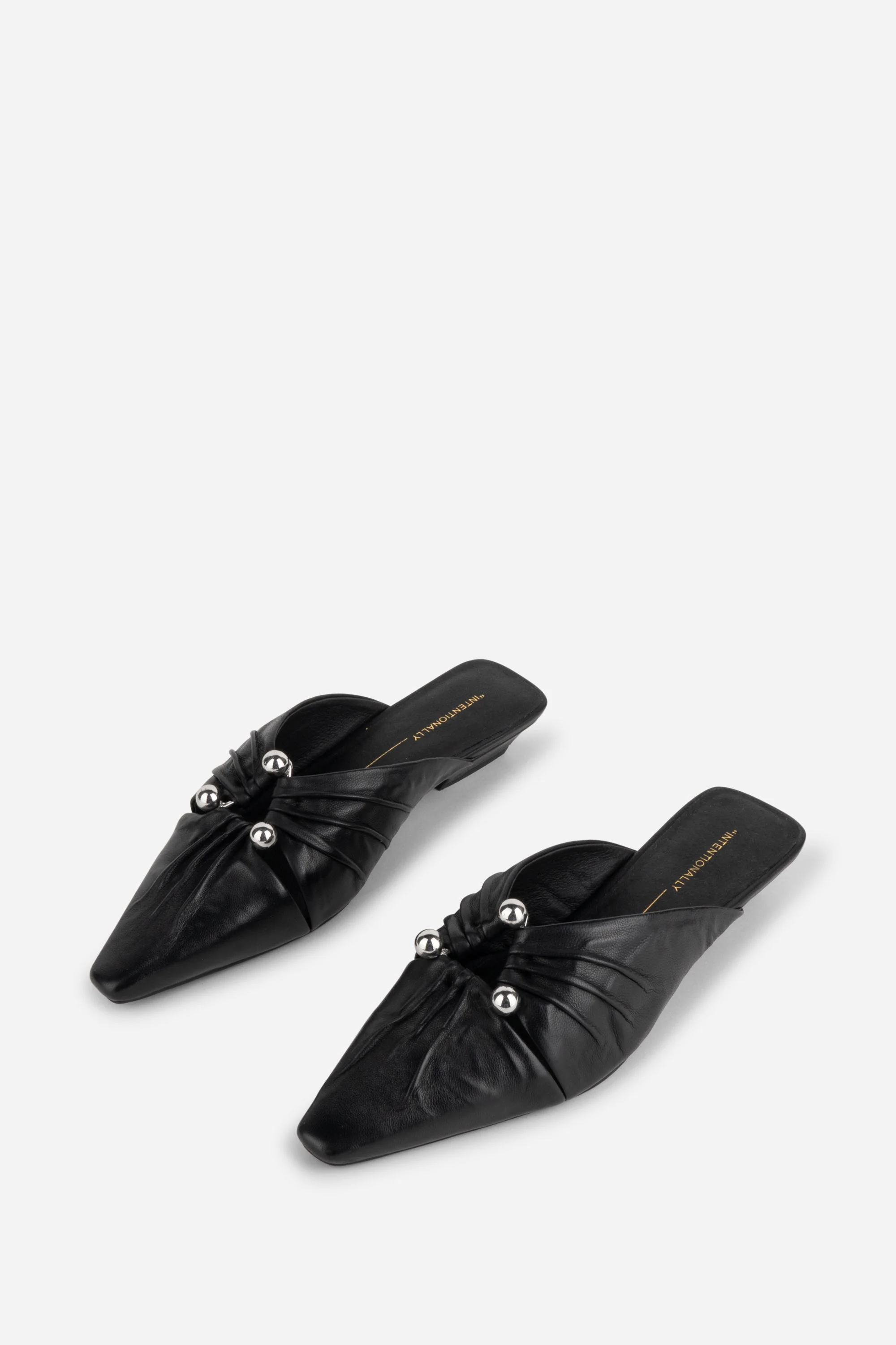 "INTENTIONALLY __________." Noah Pierced Mule